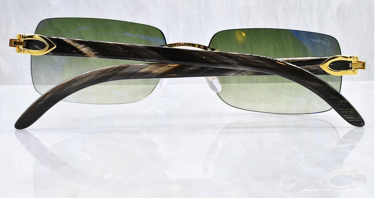 Pre-Owned Cartier Black Buffalo horn sunglasses gold/olive gradient